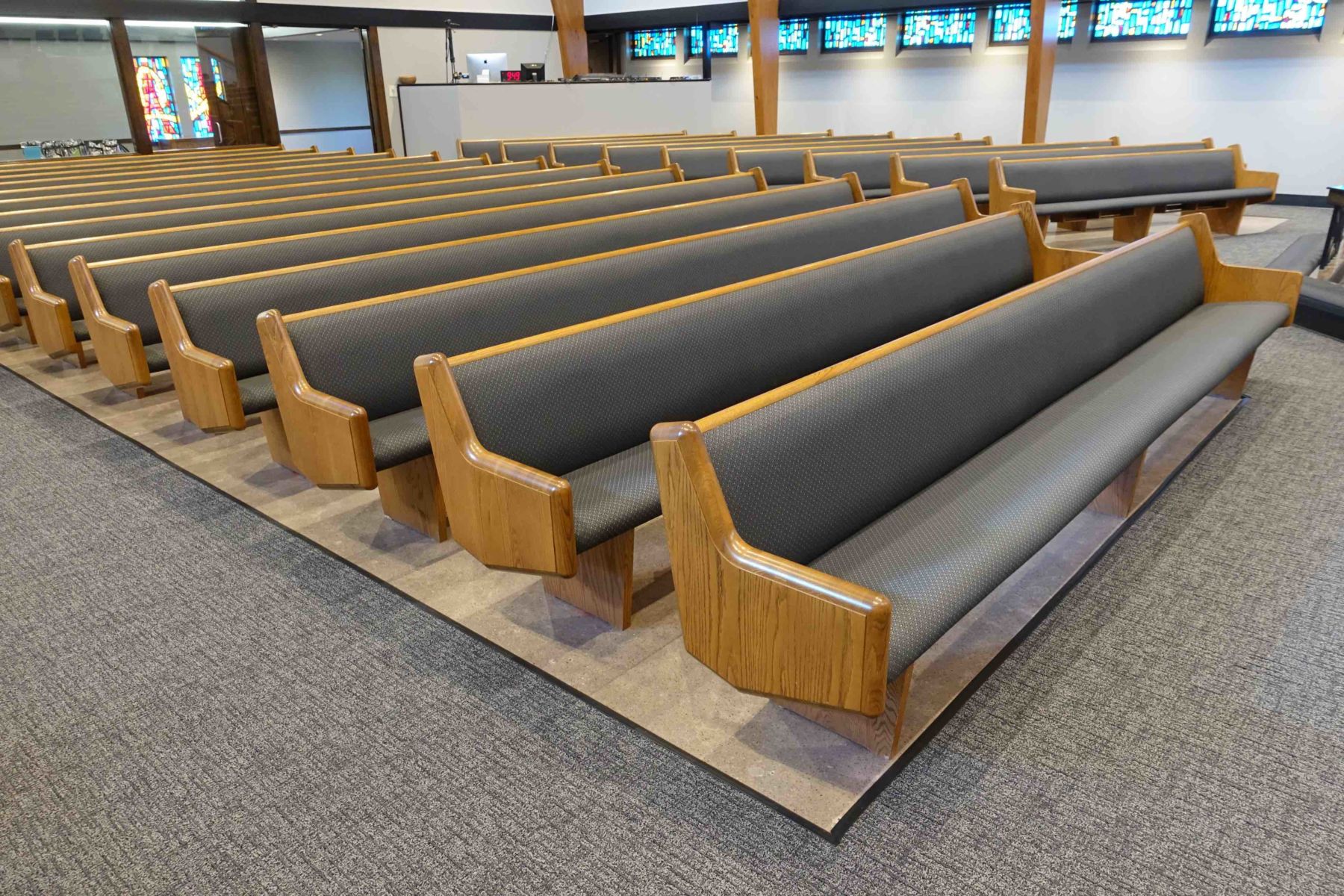 Reupholstered church pews with oak frames by Villanueva's Upholstery in San Juan, TX
